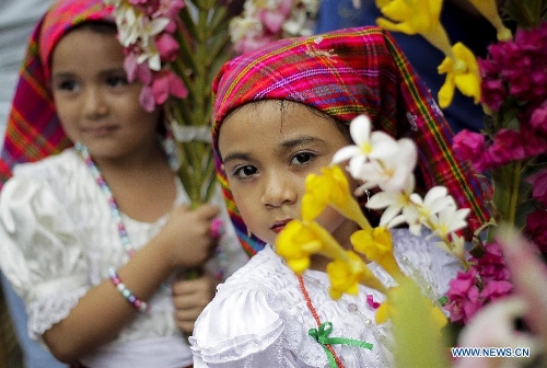 Residents participate in the procession of 