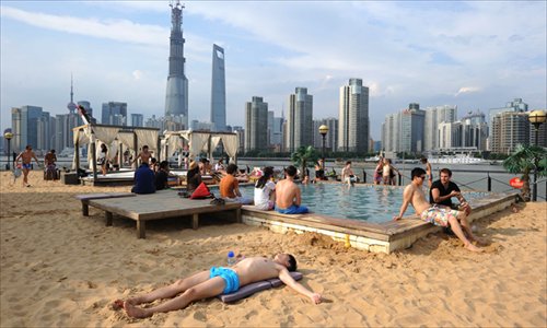 People cool off at a pool at the Cool Docks in Shanghai on Sunday. Photo: CFP