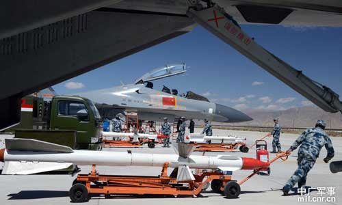 Maintenance engineers with China's Air Force were checking the J-11 fighters before their flights at an airport in Tibet on May 19. 