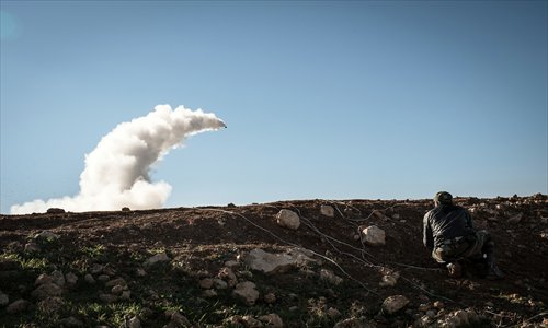 Syrian rebels launch a missile on Wednesday near the Abu Baker brigade in Albab, 30 kilometers from the northeastern Syrian city of Aleppo. Photo: AFP