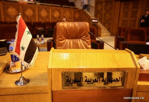 Syria's seat is seen empty during the Arab League (AL) emergency meeting at the level of permanent delegates to discuss the latest Israeli assaults on Al-Aqsa mosque, one of the three most sacred mosques for Muslims, at the AL headquarters in Cairo, May 12, 2013. (Xinhua/Amru Salahuddien) 
