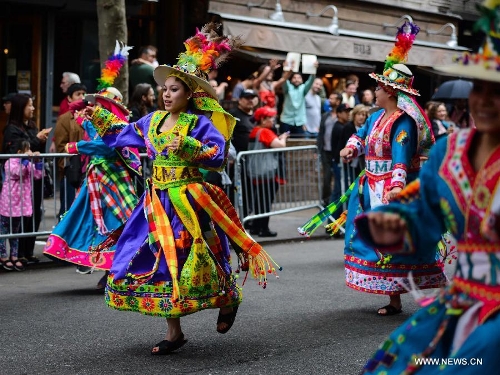People participate in the annual Dance Parade in New York, on May 18, 2013. Over 200 dance groups showcasing 80 unique dance styles and cultures gathered from Broadway to the East Village on Saturday for the 7th Dance Parade in New York. (Xinhua/Niu Xiaolei) 
