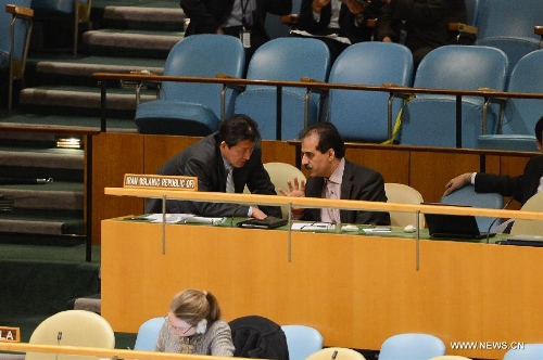 A delegate of the Democratic People's Republic of Korea (DPRK) (L) talks with a delegate of Iran during a meeting on the Arms Trade Treaty at the UN headquarters in New York, April 2, 2013. The UN General Assembly on Tuesday voted to adopt the Arms Trade Treaty, which regulates the multi-billion-U.S. dollar international arms trade. The treaty was adopted by a vote of 154 to 3, with 23 countries abstaining from the vote. The Democratic People's Republic of Korea (DPRK), Iran and Syria voted against the treaty. (Xinhua/Niu Xiaolei) 