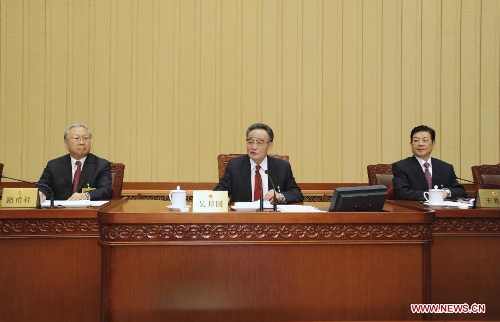  Wu Bangguo (C), chairman of the National People's Congress (NPC) Standing Committee, presides over the closing ceremony of the 31st session of the 11th NPC Standing Committee in Beijing, capital of China, Feb. 27, 2013. (Xinhua/Xie Huanchi)  