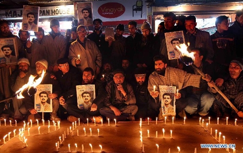 Activists of pro-independent group Jammu and Kashmir Liberation Front (JKLF) stage a torch and candle light protest in Srinagar, summer capital of Indian-controlled Kashmir, Feb. 2, 2013. Dozens of JKLF activists protest the life term sentences granted to Kashmiri separatist activists by Indian courts. JKLF under its chairmanship initiated the campaign urging Indian authorities to revoke the decisions and release the arrested. (Xinhua/Javed Dar) 