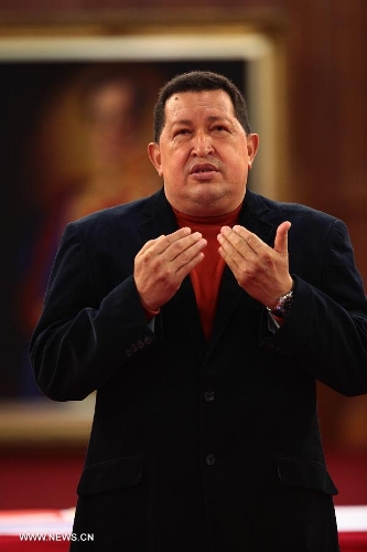 Image provided by the Presidency of Venezuela on Sept. 4, 2012 shows President Hugo Chavez participating in the delivery of aid in petro-orinco bonds to beneficiaries of basic and secondary education at the Palace of Miraflores, Caracas, capital of Venezuela. Venezuelan President Hugo Chavez died on March 5, 2013 at 16:25 (local time), according to nationally broadcast message by Venezuelan Vice President Nicolas Maduro. (Xinhua/Presidency of Venezuela) 