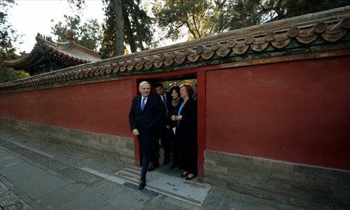 French Prime Minister Jean-Marc Ayrault (left) tours the historic Palace Museum at the start of his visit in Beijing on Thursday. Photo: AFP