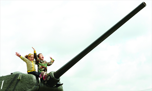Children sit atop a World War II-era Soviet T-34 tank during Victory Day celebrations in the Armenian capital Yerevan on Thursday, when Armenia as well as the other former Soviet republics celebrated the 1945 victory over Nazi Germany, the date of the Nazis' capitulation to the Soviet Union, which took place in the evening of May 8, 1945 (May 9 by Moscow Time), following the original capitulation Germany agreed upon earlier with the joint Allied forces on the Western Front. Photo: AFP