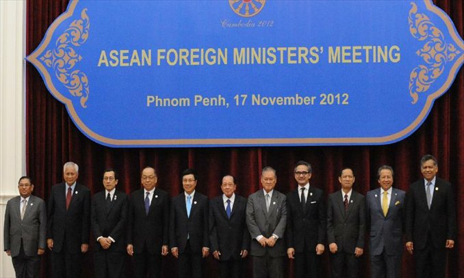 Secretary-General of Association of Southeast Asian Nations (ASEAN) Surin Pitsuwan (1st, R) and Cambodian Deputy Prime Minister and Foreign Minister Hor Nam Hong (C) pose for a group photo with foreign ministers attending the ASEAN Foreign Ministers' meeting in Phnom Penh, Cambodia on November 17, 2012. 