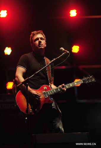 Andy Dunlop of the Scottish rock band Travis plays guitar at a performance during the 5th Strawberry Music Festival at the Tongzhou Canal Park in Beijing, capital of China, April 29, 2013. The three-day festival kicked off here on April 29, involving some 160 performing teams from at home and abroad. (Xinhua/Xiao Xiao)&nbsp;
