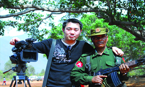 Chen Fu stands with a Myanmese soldier in October 2009 in Kokang. Photo: Courtesy of Chen Fu