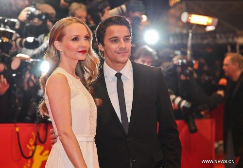 Actress Janin Reinhardt (L) and actor Kostja Ullmann pose on the red carpet for the screening of the film 