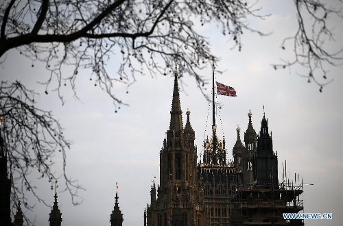 The Union Flag flies at half mast over the Houses of Parliament following the death of former British Prime Minister Baroness Margaret Thatcher in London, Britain, on April 8, 2013. It has been confirmed that Lady Thatcher died this morning following a stroke at the age of 87. (Xinhua/Wang Lili) 