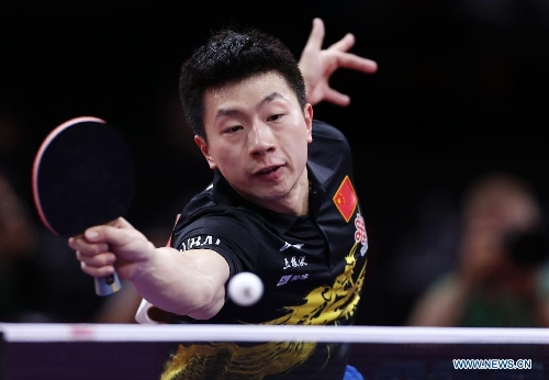 Ma Long of China competes during the semifinal of men's singles against his teammate Wang Hao at the 2013 World Table Tennis Championships in Paris, France on May 19, 2013. Ma lost 2-4. (Xinhua/Wang Lili) 