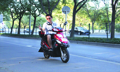 Gridlocked cars never look this happy Photo: Courtesy of BJ Electric Bike Tours