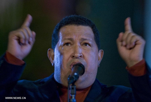 File photo taken on Oct. 6, 2012 shows Venezuelan President Hugo Chavez attending a press conference in Caracas, capital of Venezuela. Venezuelan government confirmed President Hugo Chavez's death on March 5, 2013. (Xinhua) 