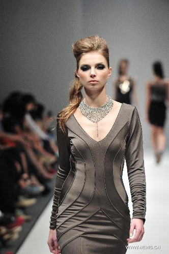A model presents a creation of Dubai based label GisellaBlu's evening and party wear collection at the Audi Fashion Festival held in Singapore's Marina Bay, May 17, 2013. (Xinhua/Then Chih Wey) 