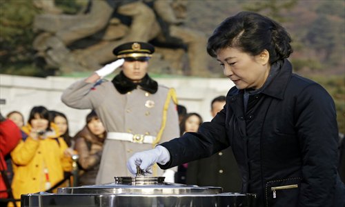 South Korea's President-elect, Park Geun-hye of the ruling New Frontier Party, burns incense during her visit to the National Cemetery in Seoul on December 20, 2012, the day after she won the country's presidential election. Photo: AFP  