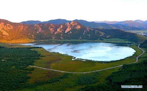 Photo taken on August 26, 2012 shows a volcanic lake in Chaihe scenic spot in Zalantun City, north China's Inner Mongolia Autonomous Region. Chaihe scenic spot is famous for its volcanic landform and primeval forest. Photo: Xinhua