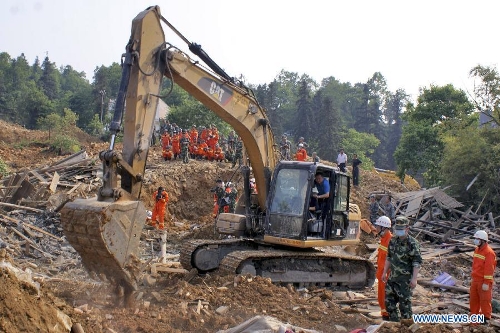 Rescuers work at the site of a landslide in Mawo Village near Bijie City, southwest China's Guizhou Province, April 28, 2013. Four villagers are confirmed dead and four others are missing after the landslide hit the village at 12:50 p.m. on April 27. (Xinhua/Luo Ji)