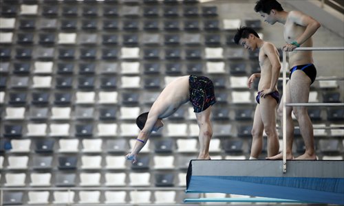 A variety of enthusiasts train at the Shanghai Oriental Sports Center for the Shanghai diving competition which is planned to open the sport up for ordinary people. Photo: Cai Xianmin/GT