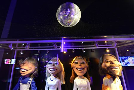 Puppet figures of  the band members share smiles at the ABBA museum in Stockholm, Sweden.
