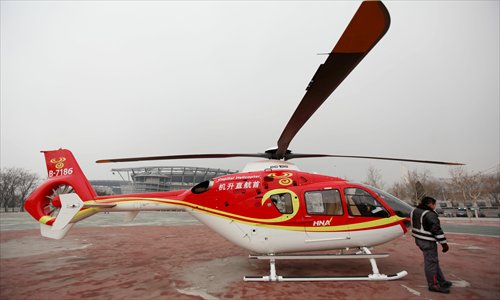 A helicopter like this will whisk the rich from the Olympic Park in Chaoyang district to sacred Buddhist Wutai Mountain. Photo: CFP