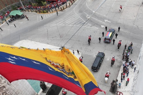 &nbsp;Image provided by Venezuela's Presidency shows the transfer of the body of late Venezuelan President Hugo Chavez from the Military Academy to the Mountain Barracks, in the city of Caracas, capital of Venezuela, on March 15, 2013. Hundreds of thousands of Venezuelans Friday marched alongside the casket of their late President Hugo Chavez, as his remains were taken to the mountaintop barracks he once called home and today houses the Historic Military Museum. (Xinhua/Venezuela's Presidency)
