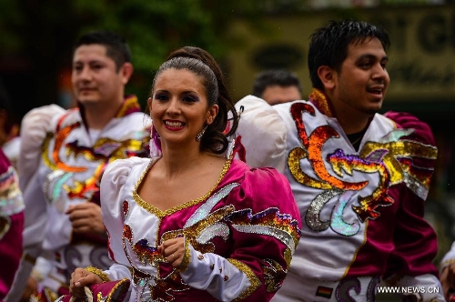 People participate in the annual Dance Parade in New York, on May 18, 2013. Over 200 dance groups showcasing 80 unique dance styles and cultures gathered from Broadway to the East Village on Saturday for the 7th Dance Parade in New York. (Xinhua/Niu Xiaolei) 