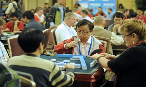 Players compete at the Third World Mahjong Championship held in Chongqing. The tournament wraps up on Tuesday. Photo: CFP