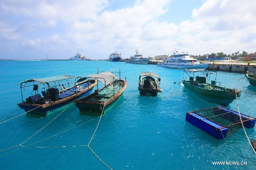 Photo taken on May 21, 2013 shows ships at a port of the Yongxing Island in Sansha City, south China's Hainan Province. (Xinhua/Zha Chunming)