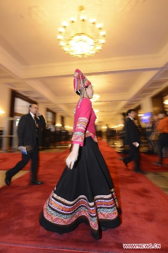  A deputy walks to the venue for the closing meeting of the first session of the 12th National People's Congress (NPC) at the Great Hall of the People in Beijing, capital of China, March 17, 2013. (Xinhua/Qi Heng)