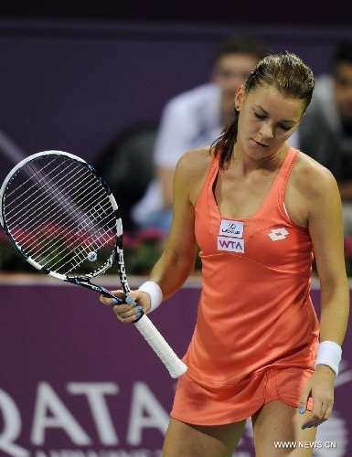 Agnieszka Radwanska of Poland reacts during the women's semifinal against Victoria Azarenka of Belarus at the Qatar Open tennis tournament in Doha, capital of Qatar, Feb. 16, 2013. Radwanska lost 0-2. (Xinhua/Chen Shaojin) 