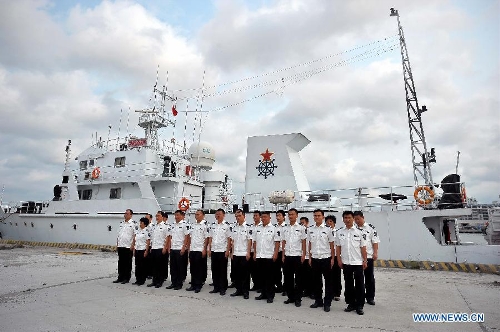 Crew of a fishery administration ship attend a ceremony before leaving the Xingang Port of Haikou, capital of south China's Hainan Province, March 26, 2013, to conduct fishery patrol missions in waters off the Xisha Islands and Huangyan Islands in the South China Sea. (Xinhua/Guo Cheng) 