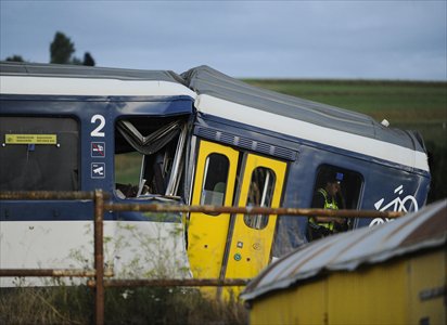 The picture shows the site of a train accident on Monday in Granges-pres-Marnand, western Switzerland. Two trains collided head-on, killing one of the drivers and injuring 35 passengers, police said.Photo: AFP