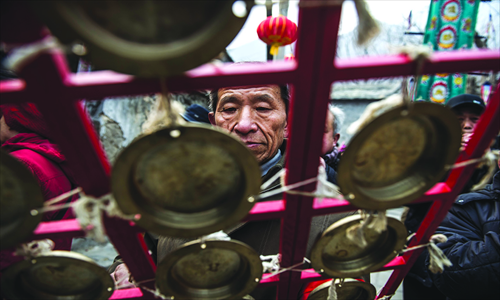 5. A village elder performs on a traditional Chinese instrument. 
Photos: Li Hao/GT   
