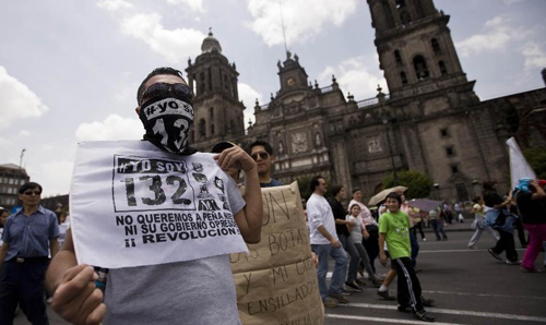 Protesters of social organizations, public and private schools' students and residents take part in a demonstration protesting against the outcome of the July 1 general elections, in Mexico City, capital of Mexico, on July 22, 2012. Protesters marched to the Zocalo in downtown Mexico City. Thousands of demonstrators marched through Mexico City on Sunday to protest the outcome of the July 1 general elections, which declared Institutional Revolutionary Party (PRI) presidential candidate Enrique Pena Nieto the winner. Photo: Xinhua