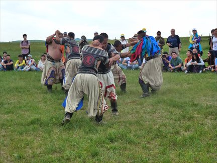 Tourists watch on in Xilinhot as local men participate in 'bökh,' a traditional form of Mongolian wrestling. Photo: Céline Herren