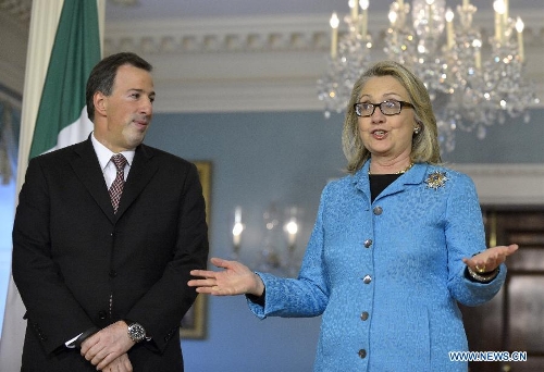 U.S. Secretary of State Hillary Clinton (R) speaks with Mexican Foreign Secretary Jose Antonio Meade at the Department of State in Washington D.C., capital of the United States, Jan. 30, 2013. It was the last bilateral meeting for Hillary Clinton as Secretary of State. (Xinhua/Zhang Jun)