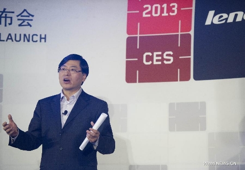 Yang Yuanqing, chairman and CEO of the&nbsp; &nbsp;Group, introduces the company's latest products during the 2013 International Consumer Electronics Show (CES) in Las Vegas, the United States, Jan. 8, 2013. (Xinhua/Yang Lei)  