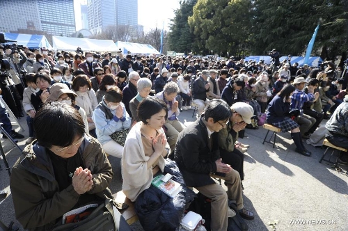&nbsp;People attend a mourning ceremony in Tokyo, capital of Japan, on March 11, 2013. A mourning ceremony was held here Monday to mark the two year anniversary of the March 11 earthquke and ensuing tsunami that left more than 19,000 people dead or missing and triggered a nuclear accident the world had never seen since 1986. (Xinhua/Kenichiro Seki) 