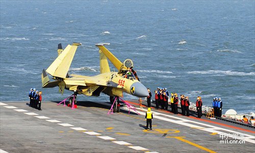 Photo shows carrier-borne J-15 fighter jet on China's first aircraft carrier, the Liaoning. Photo: mil. cnr.cn