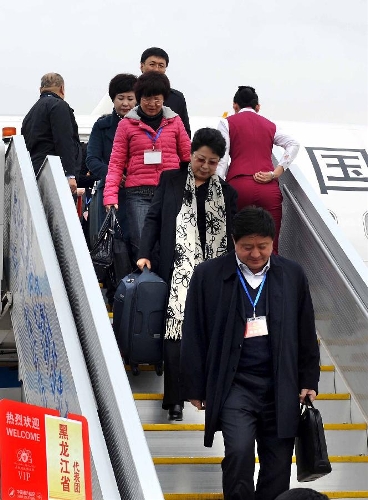 Deputies to the 12th National People's Congress (NPC) from northeast China's Heilongjiang Province arrive in Beijing, capital of China, March 2, 2013. The first session of the 12th NPC is scheduled to open in Beijing on March 5. (Xinhua/Wang Song) (hdt)