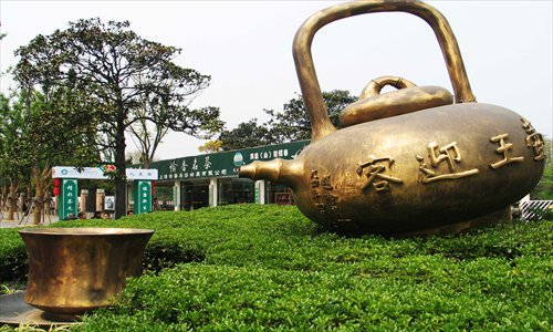 A giant teapot and teacup outside Daning International Tea City
