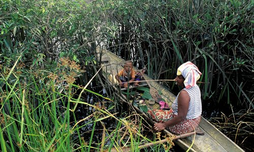 A local woman fishes in Lake Chini Photo: AFP