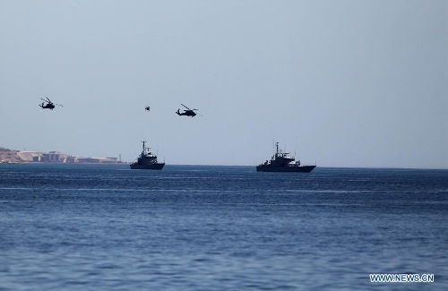 Special operations forces from Iraq, Jordan, and the U.S. conduct a vessel board search and seizure exercise as part of Eager Lion multinational military maneuvers, in the Gulf of Aqaba, Jordan, Wednesday, June, 19, 2013. The 12-day exercise involves combined air, land and sea maneuvers accross Jordan. Along wih Jordan and the U.S., the exercise brings together some 8,000 personnel from 19 Arab and European nations to train on border security, irregular warfare, anti-terrorism and counterinsurgency. (Xinhua/Mohammad Abu Ghosh) 