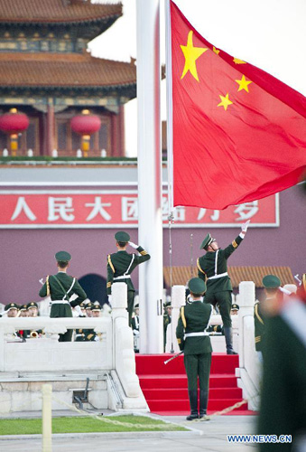 Chinese national flag is raised at the Tian'anmen Square in Beijing, capital of China, October 1, 2012. Tens of thousands of people gathered at the Tian'anmen Square to watch the national flag raising ceremony at dawn on October 1, in celebration of the 63rd anniversary of the founding of the People's Republic of China. Photo: Xinhua
