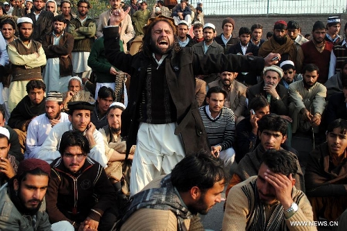 A Pakistani villager from Bara shouts slogan during a protest in northwest Pakistan's Peshawar on Jan. 16, 2013. Demonstrators said gunmen wearing military uniforms stormed homes in Bara Tehsil in Khyber Agency, some 30 kilometers from Peshawar, and shot 18 villagers dead in an overnight raid. (Xinhua/Umar Qayyum) 