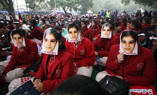 Indian students wear masks of Malala Yousufzai, a 15-year-old girl who was shot at close range in the head by a Taliban gunman in Pakistan, during a campaign to demand better budgetary allocation for health and education of Indian children in New Delhi, India, Feb. 2, 2013. (Xinhua/Partha Sarkar) 