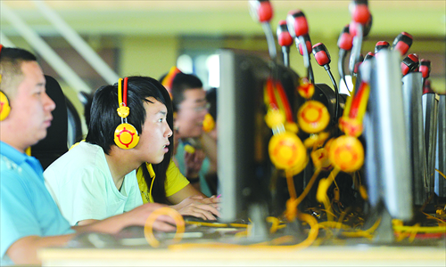 Young people play video games in an Internet cafe in Taiyuan, Shanxi Province. Playing games online is a popular hobby among many <em>diaosi</em>, who use Internet cafes to evade reality and develop a sense of achievement in online worlds. Photo: CFP